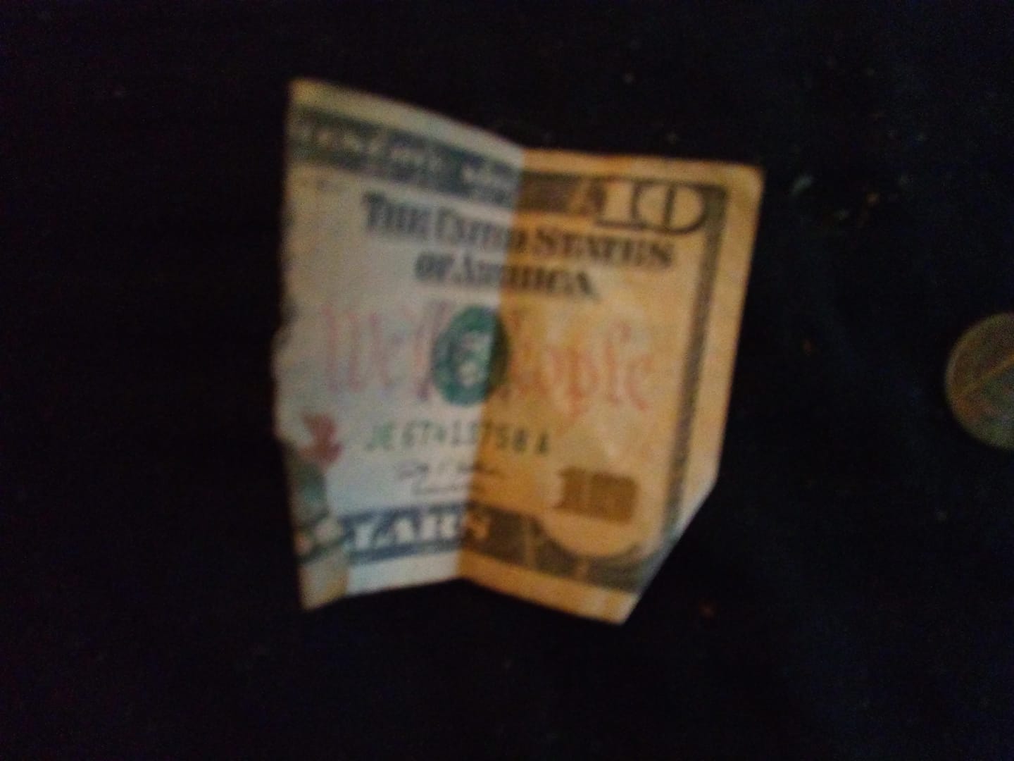 photo of a ripped ten-dollar bill
